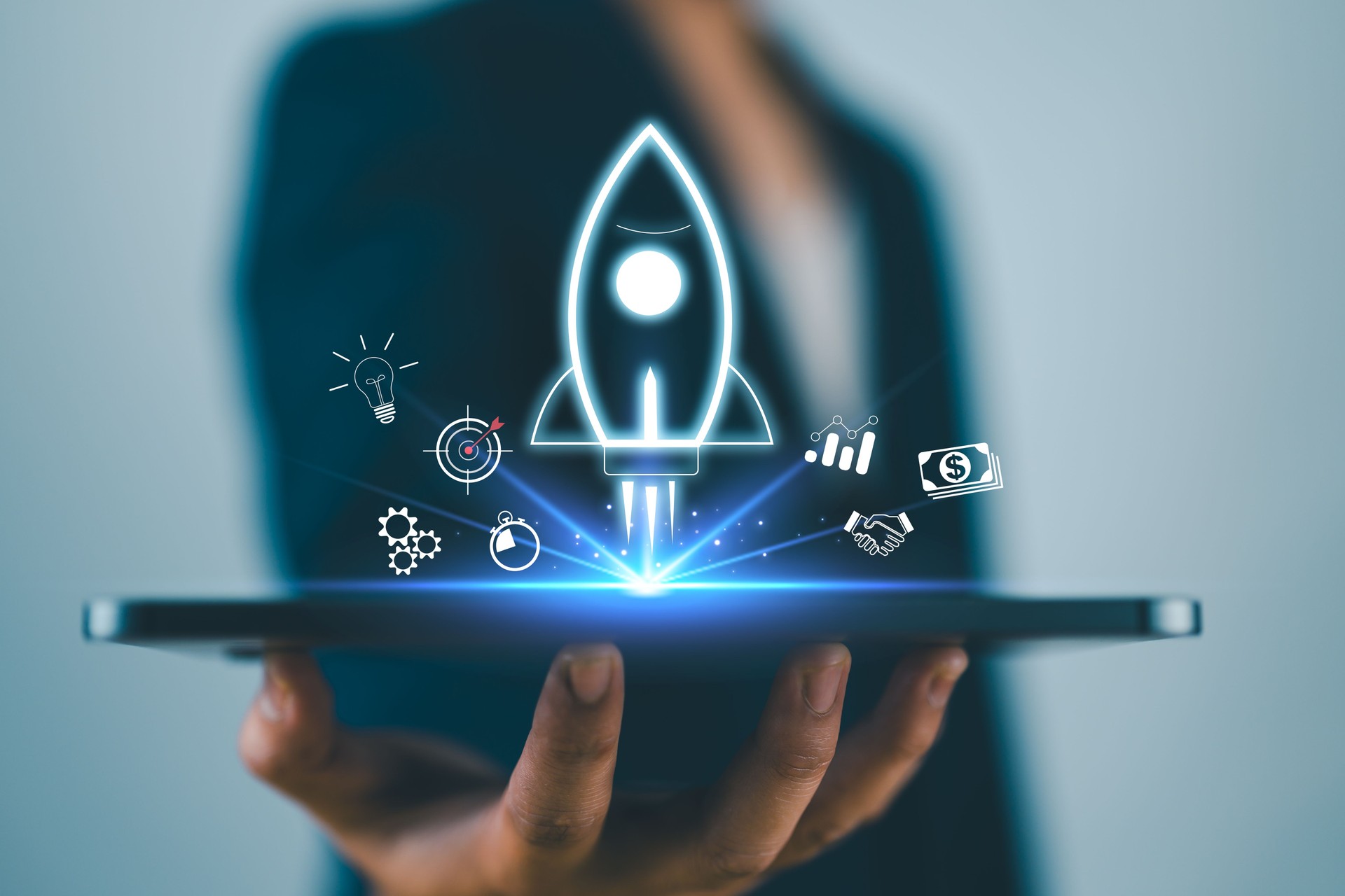 Businessman using smartphone showing rocket and icon Startup business concept Entrepreneurship concept and online digital business network connection on the interface Online Marketing, Technology